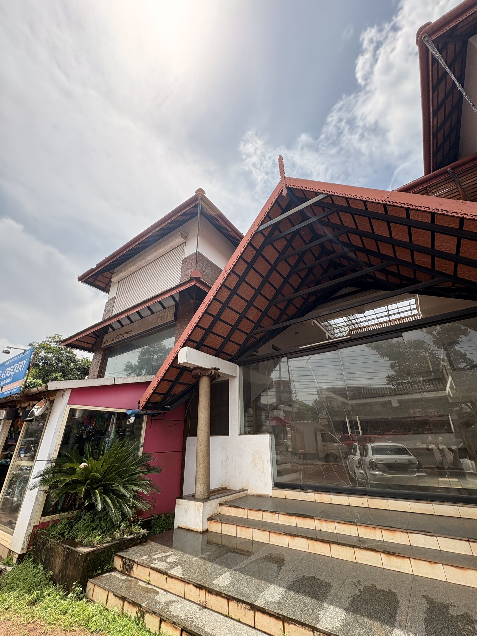 Entrance roof detail and street-facing glass frontage